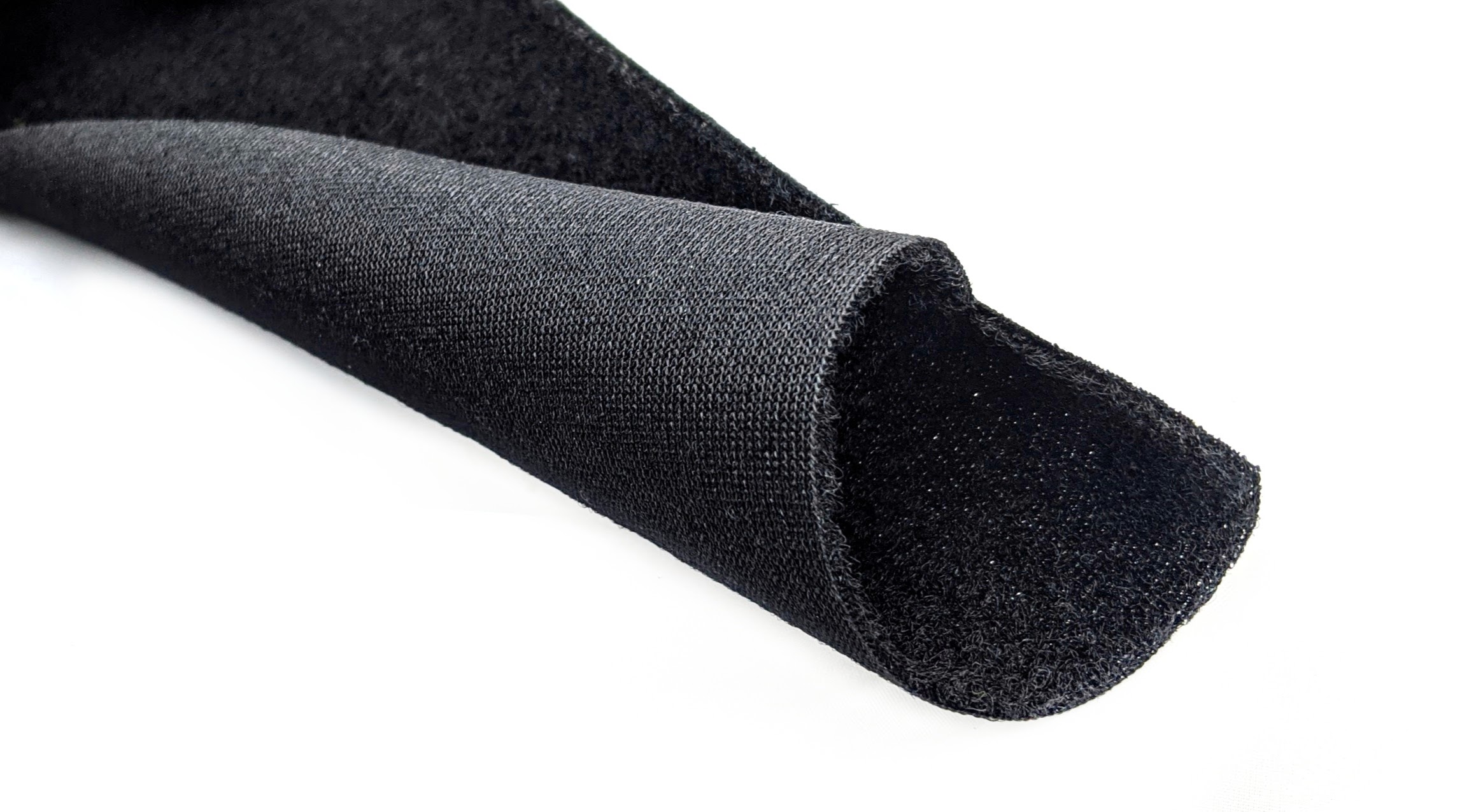 Hook-and-loop fastener aka Velcro in closeup, isolated on black Stock Photo